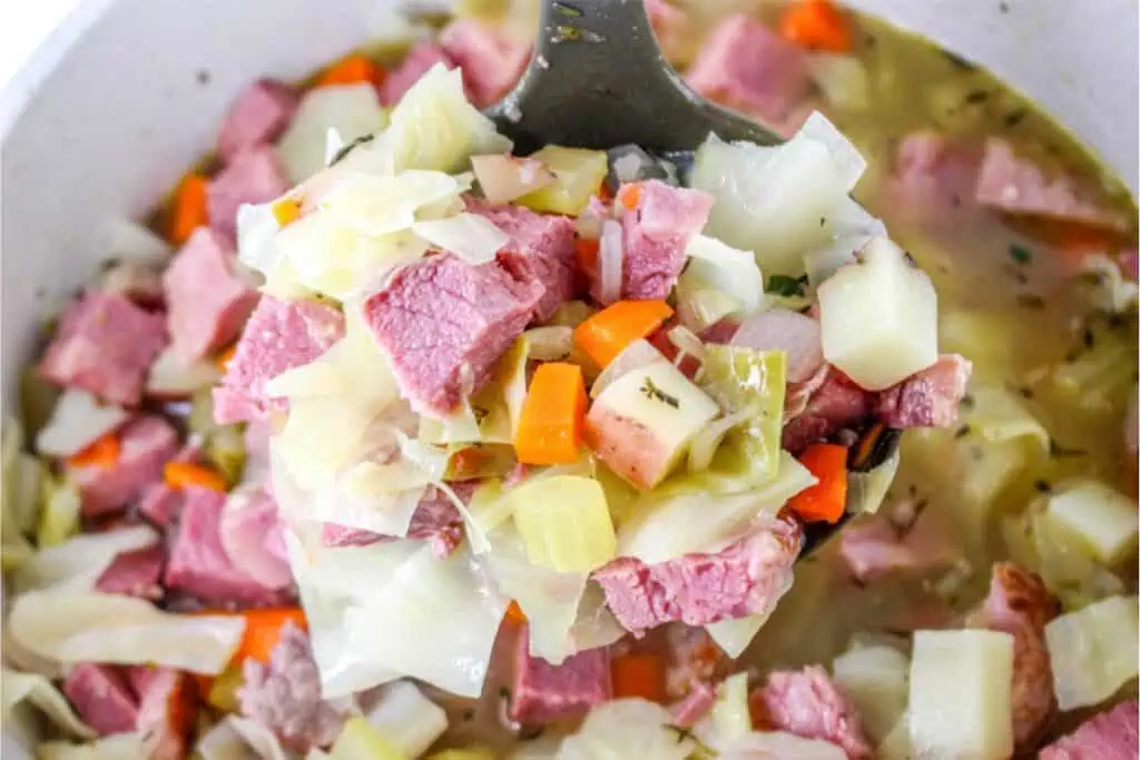 A spoonful of corned beef and cabbage soup.