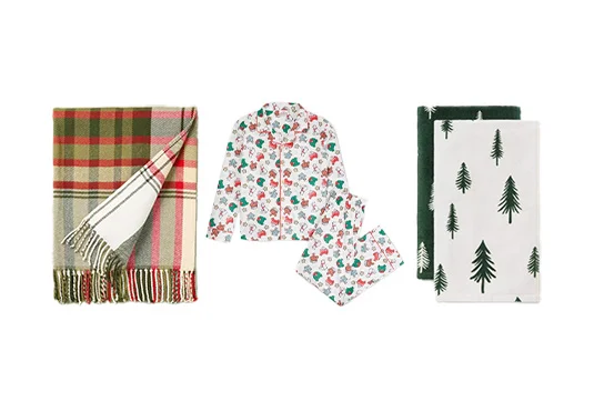 On the left, a plaid blanket from Target free collection, floral pajamas sit in the middle, and tree-patterned towels are arranged on the right, all set against a crisp white background.