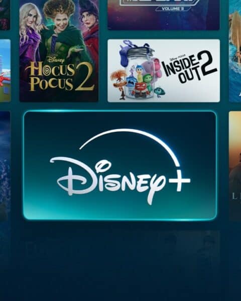 The Disney+ interface showcases an array of popular movie and TV show posters like Star Wars, Frozen II, and The Lion King, all circling the prominent Disney+ logo. Dive into this magical collection for only $1.99 per month with our special deal!.
