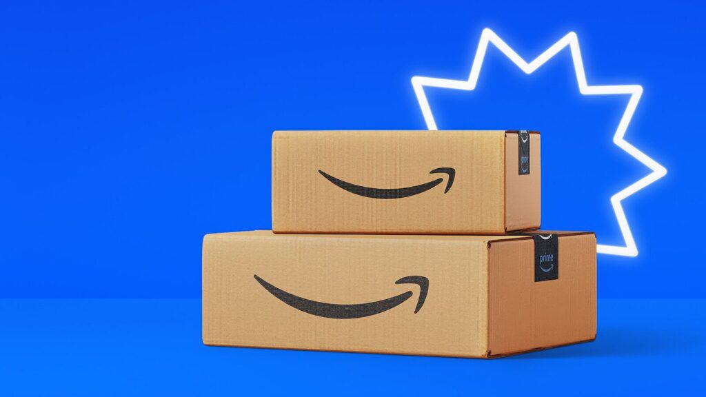 Two stacked Amazon Prime boxes sit against a blue background with a white starburst design, celebrating Big Deal Days in style.