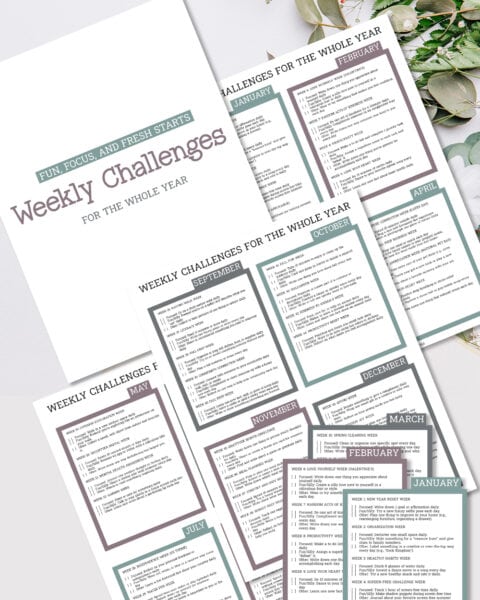 A set of printed pages titled "52-Week Challenge: Best Year Yet" is arranged on a table, accompanied by a floral arrangement.