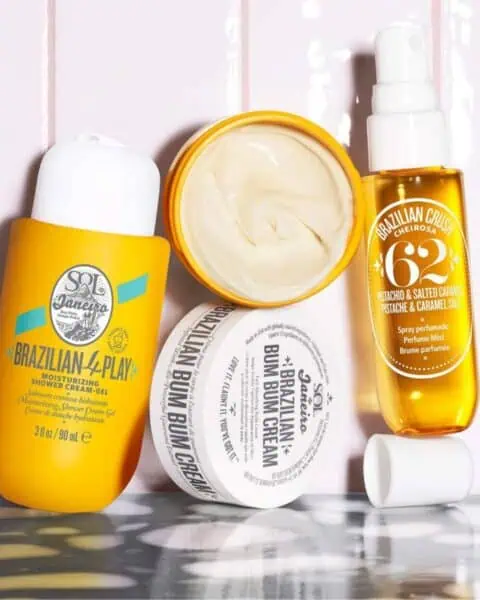 A collection of Sol de Janeiro skincare products, featuring containers and a spray bottle, beautifully displayed on a white surface. Perfect for any beauty ritual, these favorites often found at Sephora bring the essence of Brazilian Bum Bum to your routine.