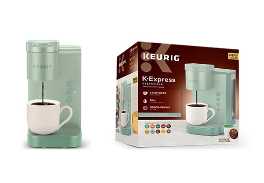 The Keurig K-Express coffee maker in green sits elegantly beside its packaging box filled with product images and details. A white mug rests on the machine's drip tray, ready to be filled with your favorite brew at the touch of a button.