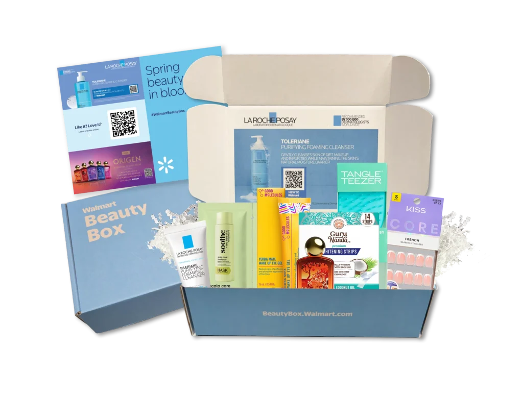 A Spring Beauty Box is open, displaying assorted skincare, haircare, and nail products, with promotional inserts placed inside and beside the signature blue Walmart Beauty Box.