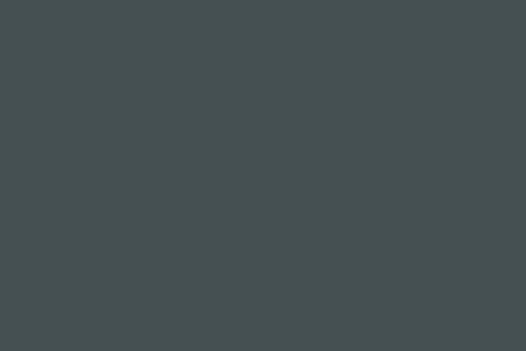 A uniform dark blue-gray color fills the entire area with no visible objects or patterns.